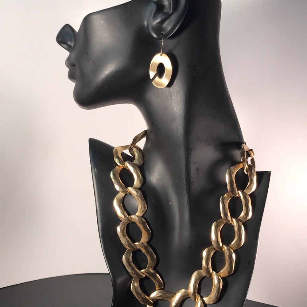 18” gold toned thin chain necklace and set of gold tone earrings